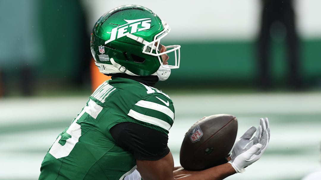 Nov 30, 2025; East Rutherford, New Jersey, USA;New York Jets wide receiver Adonai Mitchell (15) makes a touchdown catch against the Atlanta Falcons during the second half at MetLife Stadium. 
