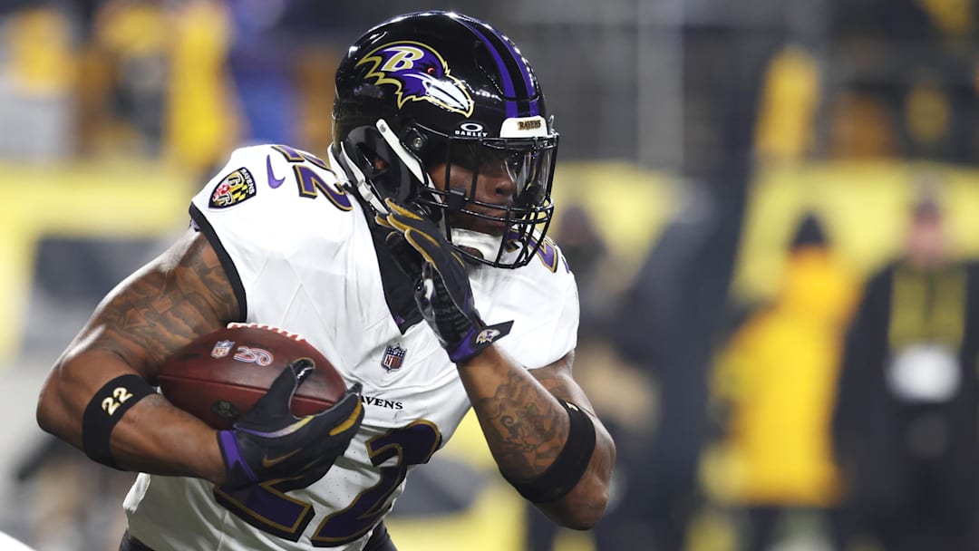 Jan 4, 2026; Pittsburgh, Pennsylvania, USA; Baltimore Ravens running back Derrick Henry (22) rushes the ball against the Pittsburgh Steelers during the first half at Acrisure Stadium. Mandatory Credit: Charles LeClaire-Imagn Images