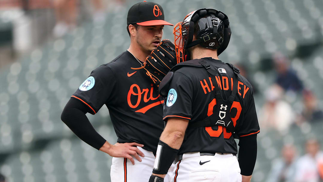 May 14, 2025; Baltimore, Maryland, USA; Baltimore Orioles pitcher Chayce McDermott (59) speaks with Baltimore Orioles catcher Maverick Handley (98) during the first inning against the Minnesota Twins at Oriole Park at Camden Yards