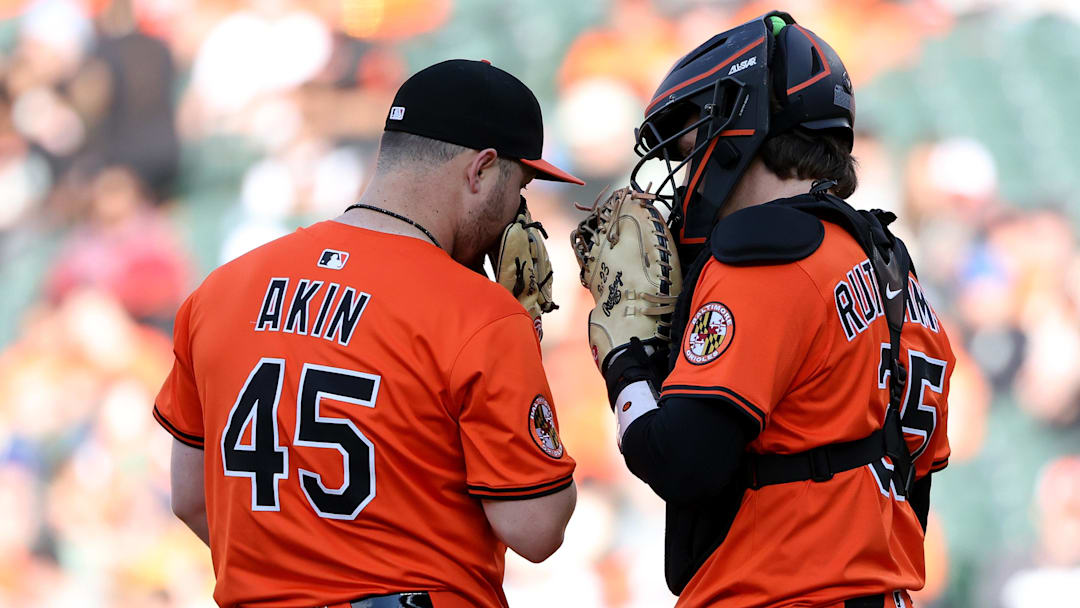 May 31, 2025; Baltimore, Maryland, USA; Baltimore Orioles pitcher Keegan Akin (45) and Baltimore Orioles catcher Adley Rutschman (35) converse during the seventh inning against the Chicago White Sox at Oriole Park at Camden Yards