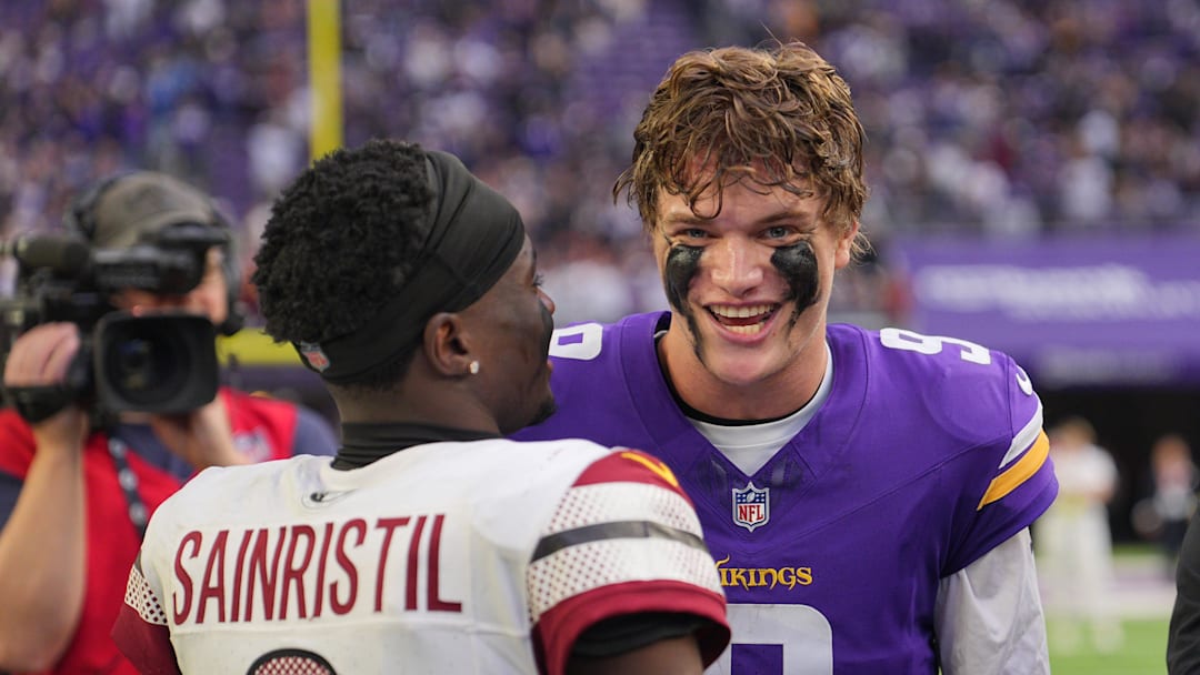 Dec 7, 2025; Minneapolis, Minnesota, USA; Minnesota Vikings quarterback J.J. McCarthy (9) reacts with Washington Commanders cornerback Mike Sainristil (0) after the game at U.S. Bank Stadium. Mandatory Credit: Brad Rempel-Imagn Images