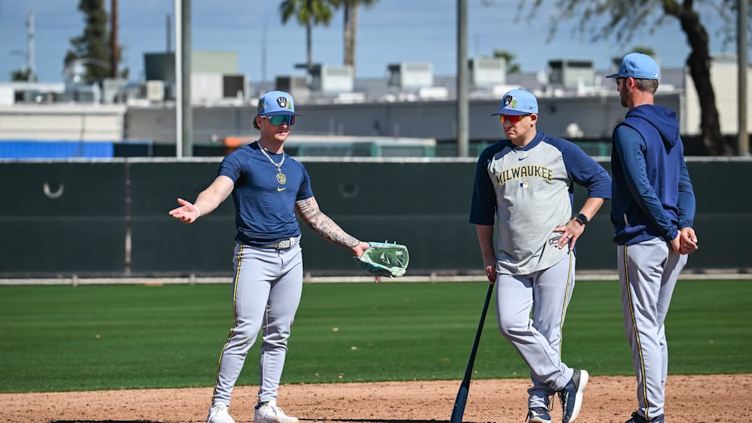 Milwaukee Brewers infielder/outfielder Jett Williams (76) works with Nashville Sounds bench coach David Tufo, center, and infield coordinator Andrew Romine at third base during spring training workouts Saturday, February 14, 2026, at American Family Fields of Phoenix in Phoenix, Arizona.
