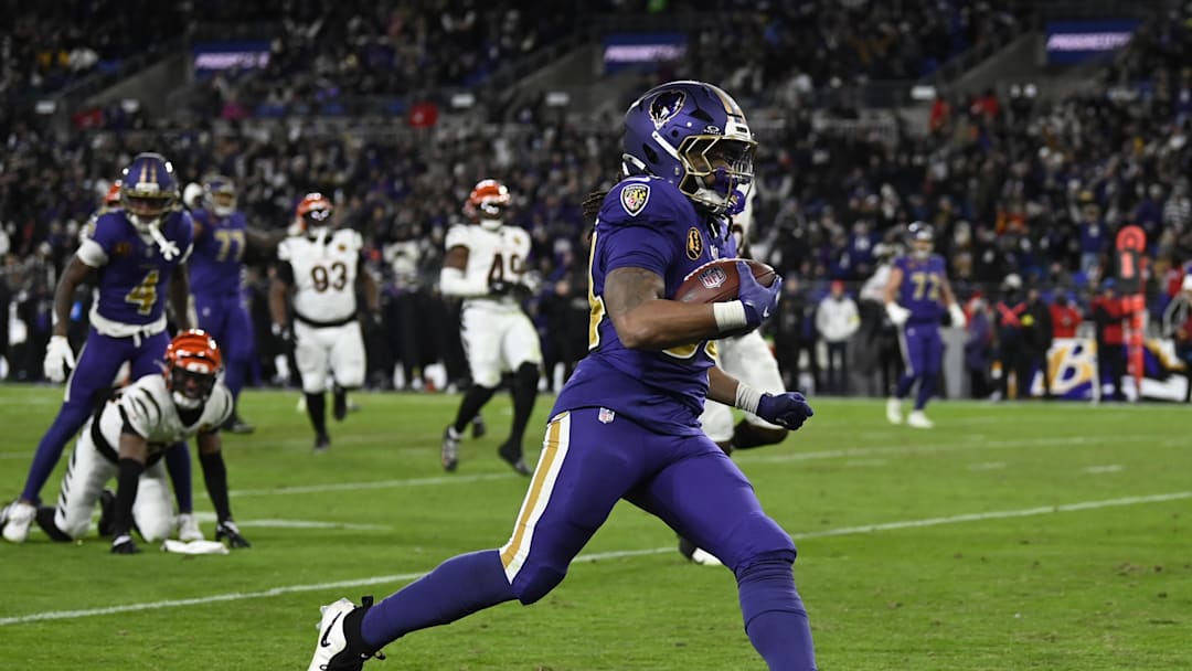 Nov 27, 2025; Baltimore, Maryland, USA; Baltimore Ravens running back Keaton Mitchell (34) rushes for a touchdown against the Cincinnati Bengals during the second half at M&T Bank Stadium. Mandatory Credit: Tommy Gilligan-Imagn Images