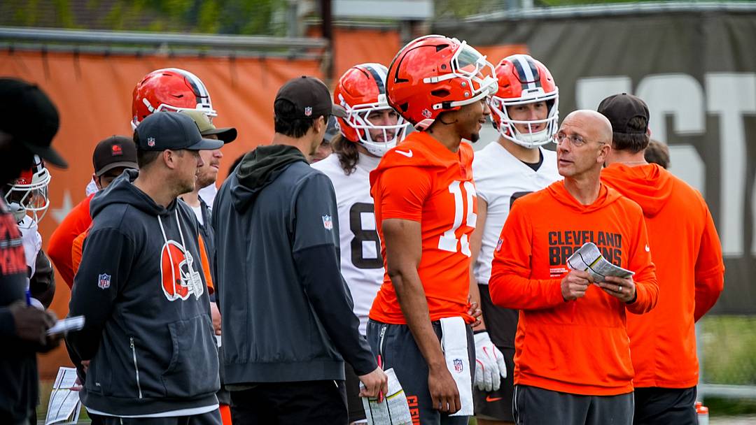 Cleveland Browns quarterback Taylen Green (15) chats with quarterbacks coach Mike Bajakian during the first day of rookie minicamp May 8, 2026, at Cross Country Mortgage Campus in Berea, Ohio.
