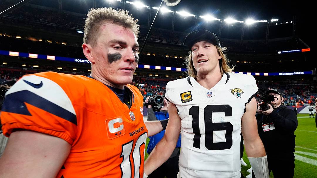 Dec 21, 2025; Denver, Colorado, USA; Denver Broncos quarterback Bo Nix (10) and Jacksonville Jaguars quarterback Trevor Lawrence (16) meet after the game at Empower Field at Mile High. Mandatory Credit: Ron Chenoy-Imagn Images