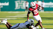 Aug 23, 2025; Honolulu, Hawaii, USA;  Hawaii Rainbow Warriors defensive lineman Tariq Jones (5) tries to tackle Stanford Cardinal running back Sedrick Irvin (26) during the second half at Clarence T.C. Ching Athletics Complex. Mandatory Credit: Marco Garcia-Imagn Images