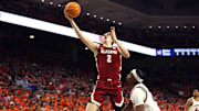 Feb 7, 2024; Auburn, Alabama, USA; Alabama Crimson Tide forward Grant Nelson (2) takes a shot over Auburn Tigers guard Denver Jones (12) during the first half at Neville Arena. Mandatory Credit: John Reed-Imagn Images
