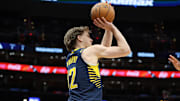 Mar 27, 2025; Washington, District of Columbia, USA; Indiana Pacers forward Johnny Furphy (12) shoots during the second half against the Washington Wizards at Capital One Arena. Mandatory Credit: Daniel Kucin Jr.-Imagn Images