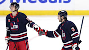 Mar 23, 2025; Winnipeg, Manitoba, CAN; Winnipeg Jets defenseman Colin Miller (6) celebrates after a goal against the Buffalo Sabres with Winnipeg Jets center Mark Scheifele (55) in the third period at Canada Life Centre. Mandatory Credit: James Carey Lauder-Imagn Images