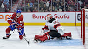 Sep 24, 2024; Montreal, Quebec, CAN; New Jersey Devils goalie Nico Daws (50) stops Montreal Canadiens forward Florian Xhekaj (60) during the third period at the Bell Centre. Mandatory Credit: Eric Bolte-Imagn Images