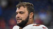 Tampa Bay Buccaneers guard Ben Bredeson (68) talks with teammates after their game against the Detroit Lions