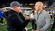 Kentucky coach Mark Stoops greets Vanderbilt coach Clark Lea after Vanderbilt won at FirstBank Stadium in Nashville, Tennessee.