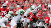 Ohio State Buckeyes running back Miyan Williams (28) is pursued by Oregon Ducks linebacker Noah Sewell (1) during Saturday's NCAA Division I football game at Ohio Stadium in Columbus on September 11, 2021.