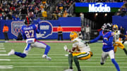 Dec 11, 2023; East Rutherford, New Jersey, USA; New York Giants safety Jason Pinnock (27) makes an interception during the second quarter against the Green Bay Packers at MetLife Stadium.  