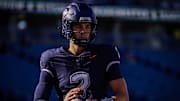 Nov 15, 2025; East Hartford, Connecticut, USA; UConn Huskies quarterback Joe Fagnano (2) warms up before the start of the game against the Air Force Falcons at Pratt & Whitney Stadium at Rentschler Field. Mandatory Credit: David Butler II-Imagn Images