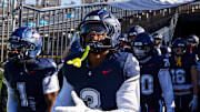 Nov 15, 2025; East Hartford, Connecticut, USA; The UConn Huskies head to the field for warm up before the start of the game against the Air Force Falcons at Pratt & Whitney Stadium at Rentschler Field. Mandatory Credit: David Butler II-Imagn Images