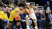 Mar 2, 2025; Ann Arbor, Michigan, USA; Michigan Wolverines guard Tre Donaldson (3) battles Illinois Fighting Illini guard Dra Gibbs-Lawhorn (2) for a loose ball in the first half at Crisler Center. Mandatory Credit: Lon Horwedel-Imagn Images