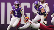 Dec 7, 2025; Minneapolis, Minnesota, USA; Minnesota Vikings quarterback J.J. McCarthy (9) rushes the ball past Washington Commanders outside linebacker Von Miller (24) during the first half at U.S. Bank Stadium.