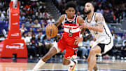 Mar 29, 2025; Washington, District of Columbia, USA; Washington Wizards guard AJ Johnson (5) drives past Brooklyn Nets guard Tyrese Martin (13) during the second half at Capital One Arena. Mandatory Credit: Daniel Kucin Jr.-Imagn Images