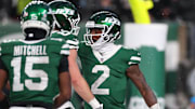 Nov 30, 2025; East Rutherford, New Jersey, USA; New York Jets quarterback Tyrod Taylor (2) reacts after a touchdown against the Atlanta Falcons during the second half at MetLife Stadium. Mandatory Credit: Vincent Carchietta-Imagn Images