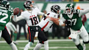 Nov 30, 2025; East Rutherford, New Jersey, USA;  Atlanta Falcons quarterback Kirk Cousins (18) drops back to pass against the New York Jets during the first half at MetLife Stadium. Mandatory Credit: Vincent Carchietta-Imagn Images