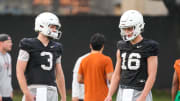 Quarterbacks Quinn Ewers (3) and Arch Manning (16) talk during the first Texas Longhorns football practice of 2023 at the Frank Denius Fields on the University of Texas at Austin campus on Monday, March 6, 2023.