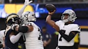 Nov 30, 2025; Inglewood, California, USA;Las Vegas Raiders quarterback Geno Smith (7) drops back to pass against the Los Angeles Chargers during the first half at SoFi Stadium. Mandatory Credit: Kiyoshi Mio-Imagn Images