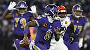 Nov 27, 2025; Baltimore, Maryland, USA; Baltimore Ravens quarterback Lamar Jackson (8) rushes thebasl against the Cincinnati Bengals during the second half at M&T Bank Stadium. Mandatory Credit: Tommy Gilligan-Imagn Images