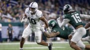 Nov 24, 2023; Detroit, Michigan, USA; Penn State Nittany Lions running back Nicholas Singleton (10) runs with the ball against the Michigan State Spartans during the second half at Ford Field. Mandatory Credit: David Reginek-USA TODAY Sports