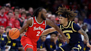 Feb 16, 2025; Columbus, Ohio, USA;  Ohio State Buckeyes guard Bruce Thornton (2) dribbles the ball as Michigan Wolverines guard Tre Donaldson (3) defends during the first half at Value City Arena. Mandatory Credit: Joseph Maiorana-Imagn Images