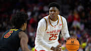 Feb 20, 2025; College Park, Maryland, USA; Maryland Terrapins center Derik Queen (25) handles the ball during the second half against USC Trojans guard Wesley Yates III (6) at Xfinity Center. Mandatory Credit: Reggie Hildred-Imagn Images