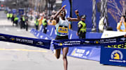 Hellen Obiri of Kenya crosses the finish line to win the women's division at the 2024 Boston Marathon.