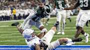 Nov 24, 2023; Detroit, Michigan, USA; Penn State Nittany Lions tight end Theo Johnson (84) scores a touchdown against the Michigan State Spartans during the second half at Ford Field. Mandatory Credit: David Reginek-Imagn Images