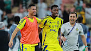 Al Nassr players Jhon Duran and Cristiano Ronaldo celebrate after a Saudi Pro League match
