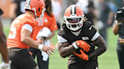 Cleveland Browns running back Quinshon Judkins (10) runs with the ball during mini camp at CrossCountry Mortgage Campus