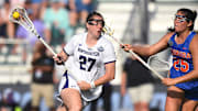 May 24, 2024; Cary, NC, USA;  Northwestern Wildcats Izzy Scane (27) drives to the goal against Florida Gators Theresa Bragg (25) during the NCAA Div. 1 womenís lacrosse semifinal at WakeMed Soccer Park. Mandatory Credit: Jeffrey Camarati-Imagn Images