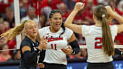 Nebraska DS/Libero Olivia Mauch, outside hitter Teraya Sigler, and setter Bergen Reilly celebrate a point during the Red-White Scrimmage on Saturday.