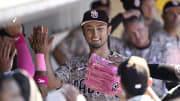 May 12, 2024; San Diego, California, USA; San Diego Padres starting pitcher Yu Darvish (11) is greeted in the dugout after pitching the seventh inning against the Los Angeles Dodgers at Petco Park. 