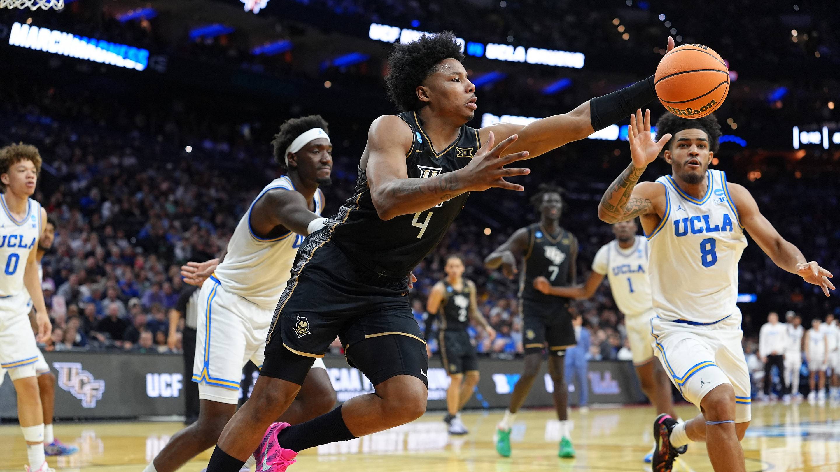 Mar 20, 2026; Philadelphia, PA, USA; UCF Knights forward Jamichael Stillwell (4) reaches for a rebound against the UCLA Bruins in the second half during a first round game of the men's 2026 NCAA Tournament at Xfinity Mobile Arena. Mandatory Credit: Kyle Ross-Imagn Images | IMAGN IMAGES via Reuters C
