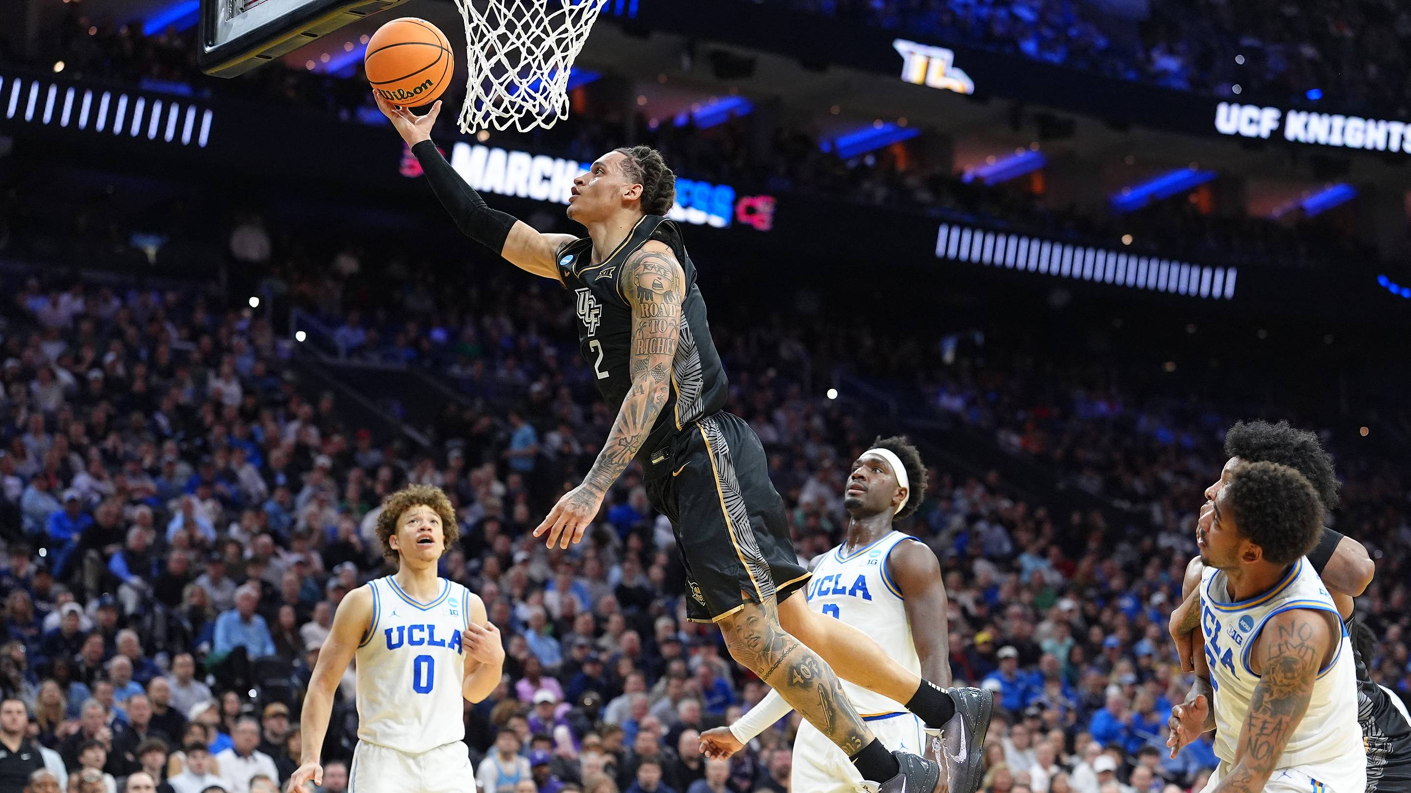 Mar 20, 2026; Philadelphia, PA, USA; UCF Knights guard Riley Kugel (2) shoots the ball against the UCLA Bruins in the second half during a first round game of the men's 2026 NCAA Tournament at Xfinity Mobile Arena. Mandatory Credit: Kyle Ross-Imagn Images | IMAGN IMAGES via Reuters Connect