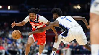 Mar 21, 2025; Washington, District of Columbia, USA; Orlando Magic forward Jonathan Isaac (1) steals the ball from Washington Wizards guard Bub Carrington (8) during the third quarter at Capital One Arena. Mandatory Credit: Reggie Hildred-Imagn Images