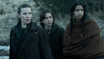 AMERICAN PRIMEVAL. (L to R) Betty Gilpin as Sara Rowell, Preston Mota as Devin Rowell, and Shawnee Pourier as Two Moons in Episode 106 of American Primeval. Cr. Justin Lubin/NETFLIX © 2024