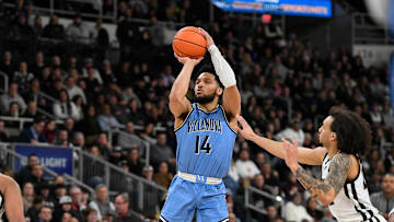 Feb 18, 2023; Providence, Rhode Island, USA; Villanova Wildcats guard Caleb Daniels (14) shoots against the Villanova Wildcats during the second half at Amica Mutual Pavilion. Mandatory Credit: Eric Canha-Imagn Images