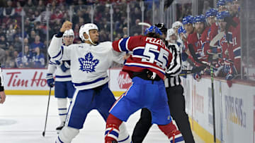 Apr 6, 2024; Montreal, Quebec, CAN; Toronto Maple Leafs forward Ryan Reaves (75) fights Montreal Canadiens forward Michael Pezzetta (55) during the second period at the Bell Centre. Mandatory Credit: Eric Bolte-Imagn Images