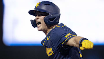 Jun 8, 2024; Chapel Hill, NC, USA; West Virginia Mountaineers Sam White (11) reacts to getting on base against the North Carolina Tar Heels in the ninth inning of the DI Baseball Super Regional at Boshamer Stadium. Mandatory Credit: Jeffrey Camarati-Imagn Images

