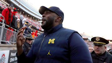 Nov 30, 2024; Columbus, Ohio, USA;  Michigan Wolverines head coach Sherrone Moore reacts to fans heckling him after the game against the Ohio State Buckeyes at Ohio Stadium. Mandatory Credit: Joseph Maiorana-Imagn Images
