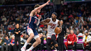 Mar 31, 2024; Washington, District of Columbia, USA; Miami Heat forward Jimmy Butler (22) drives to the basket against Washington Wizards forward Corey Kispert (24) during the second quarter at Capital One Arena. Mandatory Credit: Reggie Hildred-Imagn Images