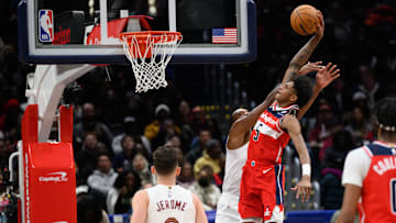 Feb 7, 2025; Washington, District of Columbia, USA; Washington Wizards guard AJ Johnson (5) dunks the ball over Cleveland Cavaliers forward Evan Mobley (4) during the third quarter at Capital One Arena. Mandatory Credit: Reggie Hildred-Imagn Images