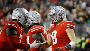 Nov 18, 2023; Columbus, Ohio, USA;  Ohio State Buckeyes tight end Cade Stover (8) celebrates his touchdown catch with tight end Gee Scott Jr. (88) during the third quarter against the Minnesota Golden Gophers at Ohio Stadium. Mandatory Credit: Joseph Maiorana-USA TODAY Sports