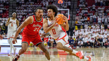 Dec 4, 2024; College Park, Maryland, USA; Maryland Terrapins guard Ja'Kobi Gillespie (0) drives to the basket against Ohio State Buckeyes forward Devin Royal (21) during the second half at Xfinity Center. Mandatory Credit: Reggie Hildred-Imagn Images